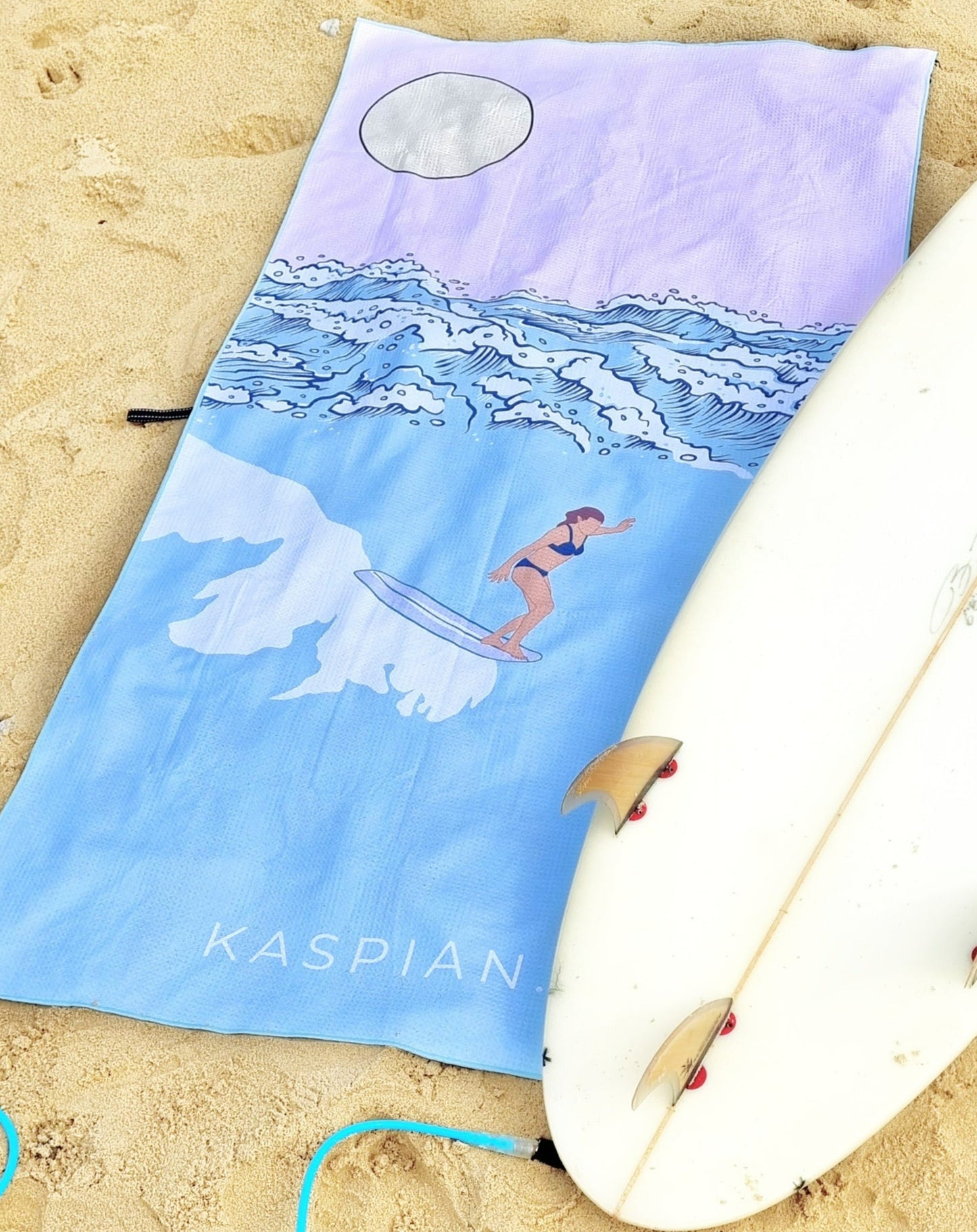 Lady riding wave on sand free beach towel and surfboard