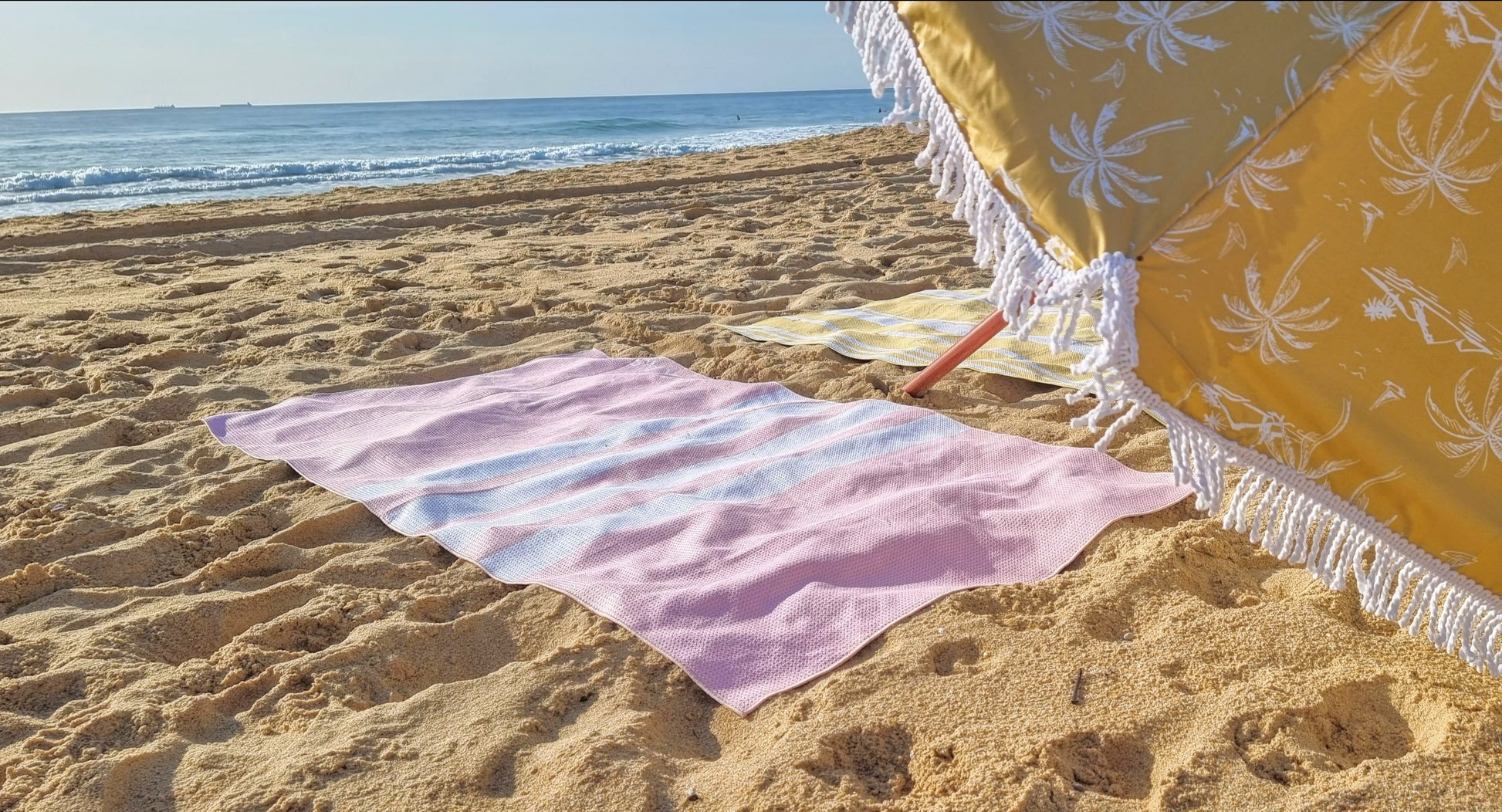 Bondi sand free beach towel near the sea