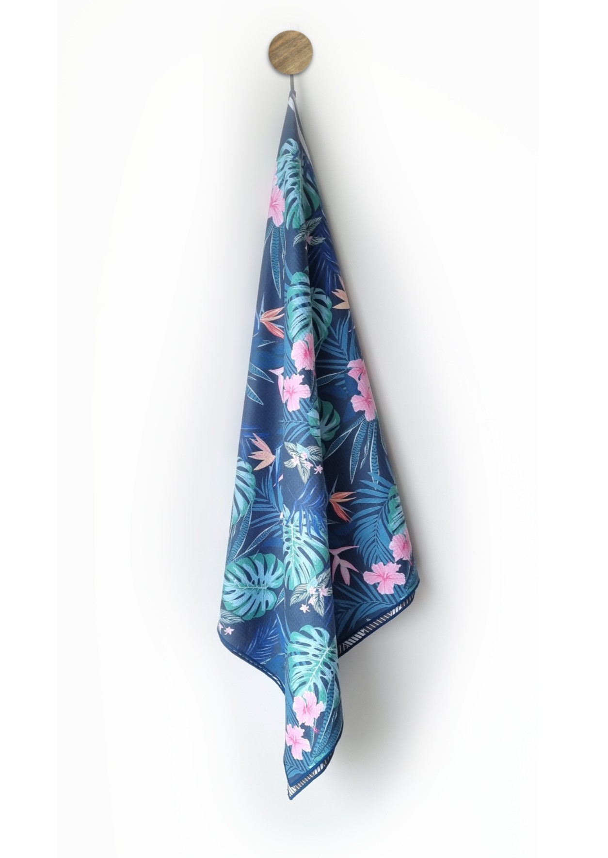 Noosa sand free beach towel hanging on bathroom hook