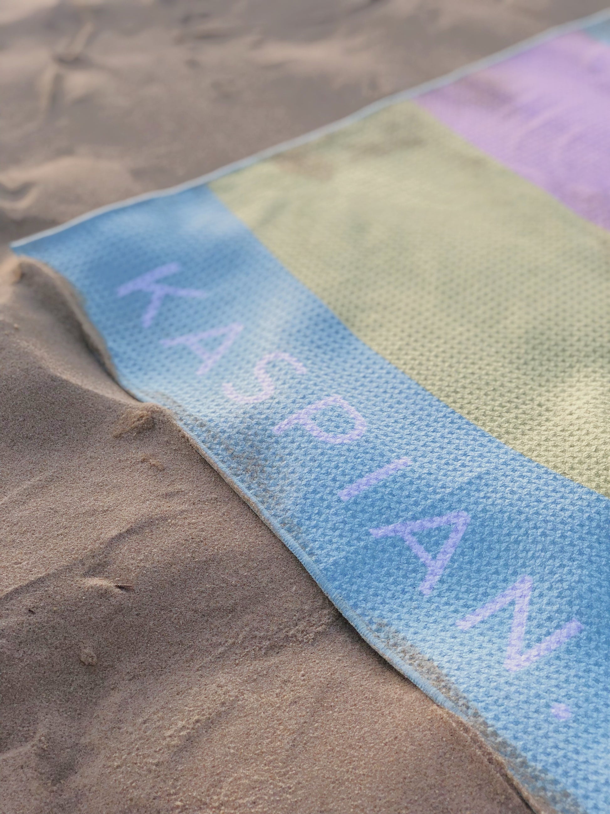 Kaspian towel. Byron sand free beach towel on the sand